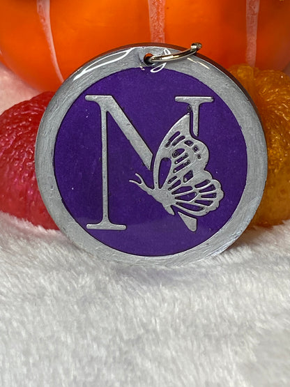 Round Purple with Silver Letters & Symbols Keychains