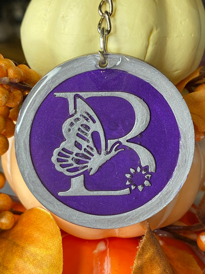 Round Purple with Silver Letters & Symbols Keychains