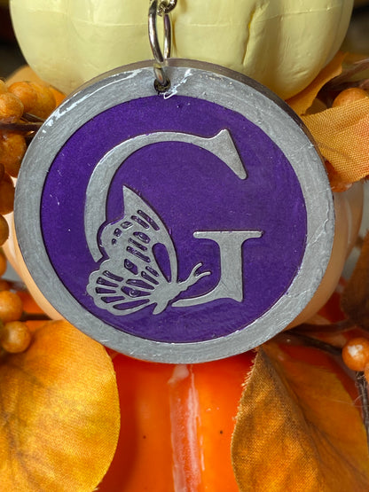 Round Purple with Silver Letters & Symbols Keychains